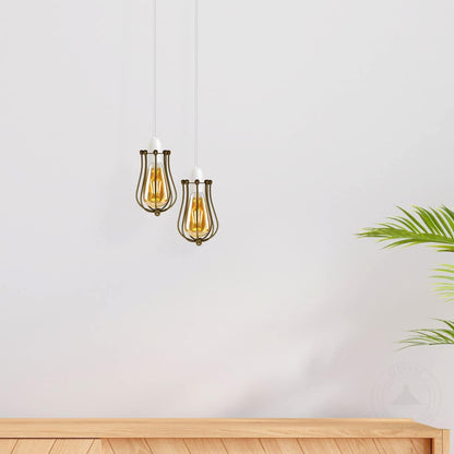 Two hanging pendant lights with gold accents on a white wall.
